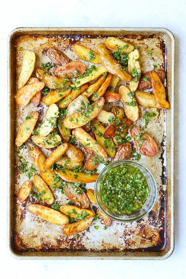 The crispiest potato wedges (completely baked!), pairing so well with any main dish. Served with the easiest flavor-packed garlic-herb sauce!